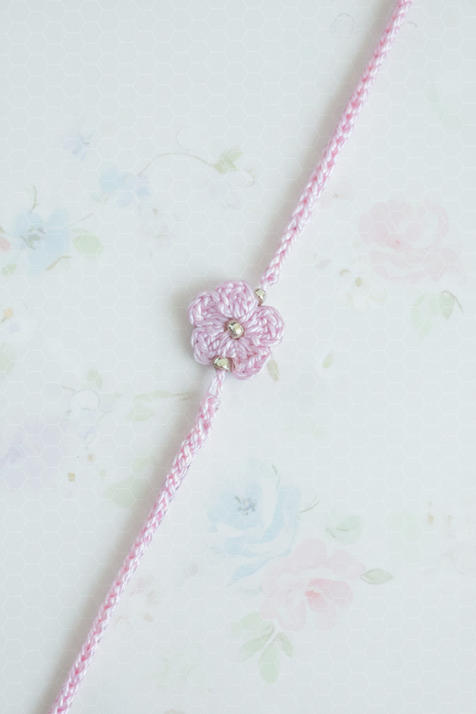 fine thread pink daisy rakhi